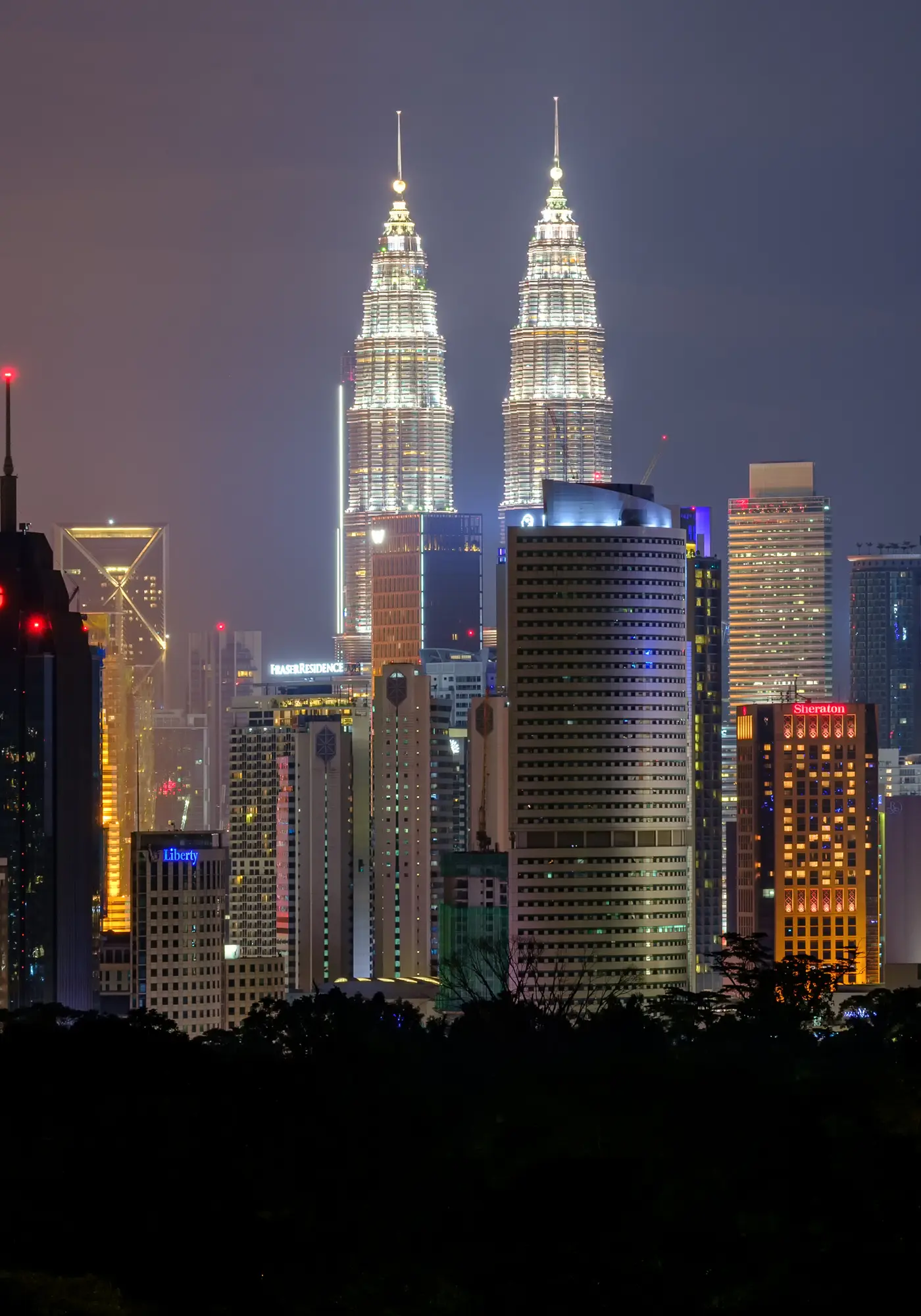 The Petronas Twin Towers and the Kuala Lumpur skyline at night