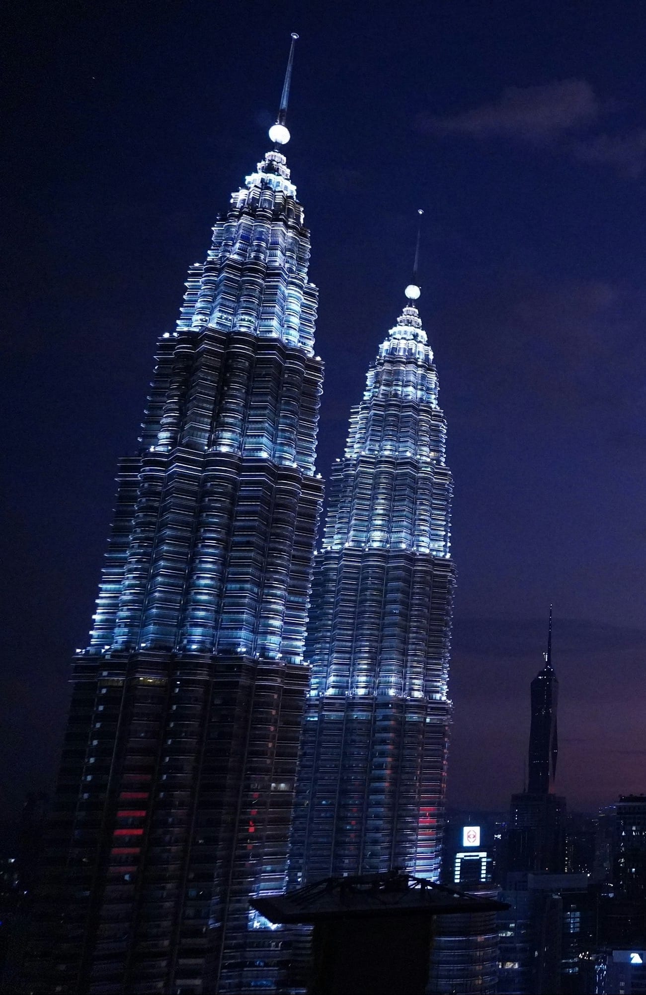 The Petronas Twin Towers and the Kuala Lumpur skyline at dusk