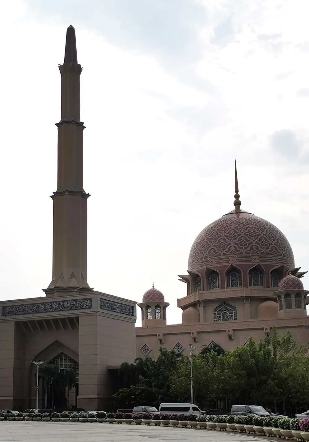 The pink dome and tall minaret of the Putra Mosque in Putrajaya, Malaysia