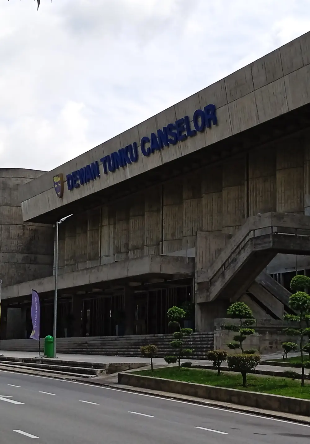 The concrete Dewan Tunku Canselor hall on a university campus in Kuala Lumpur