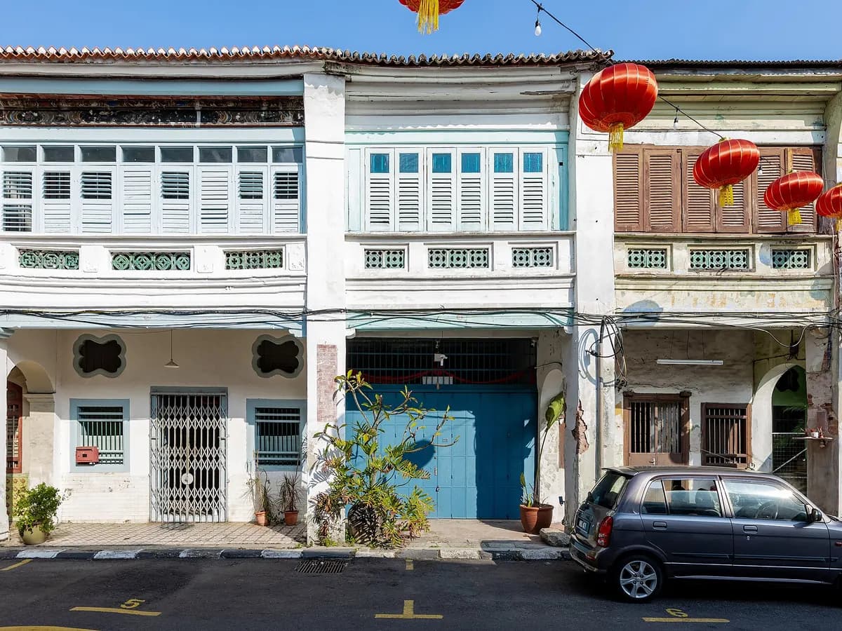 Heritage shophouses decorated with red lanterns on Lebuh Armenian in George Town, Penang